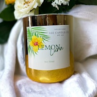 a jar with a candle and flowers next to it