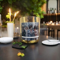 a candle is sitting on a table next to a plate of food